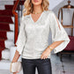 Céline | Glamour-Bluse – Ausgestellte Ärmel und glitzernde Details 